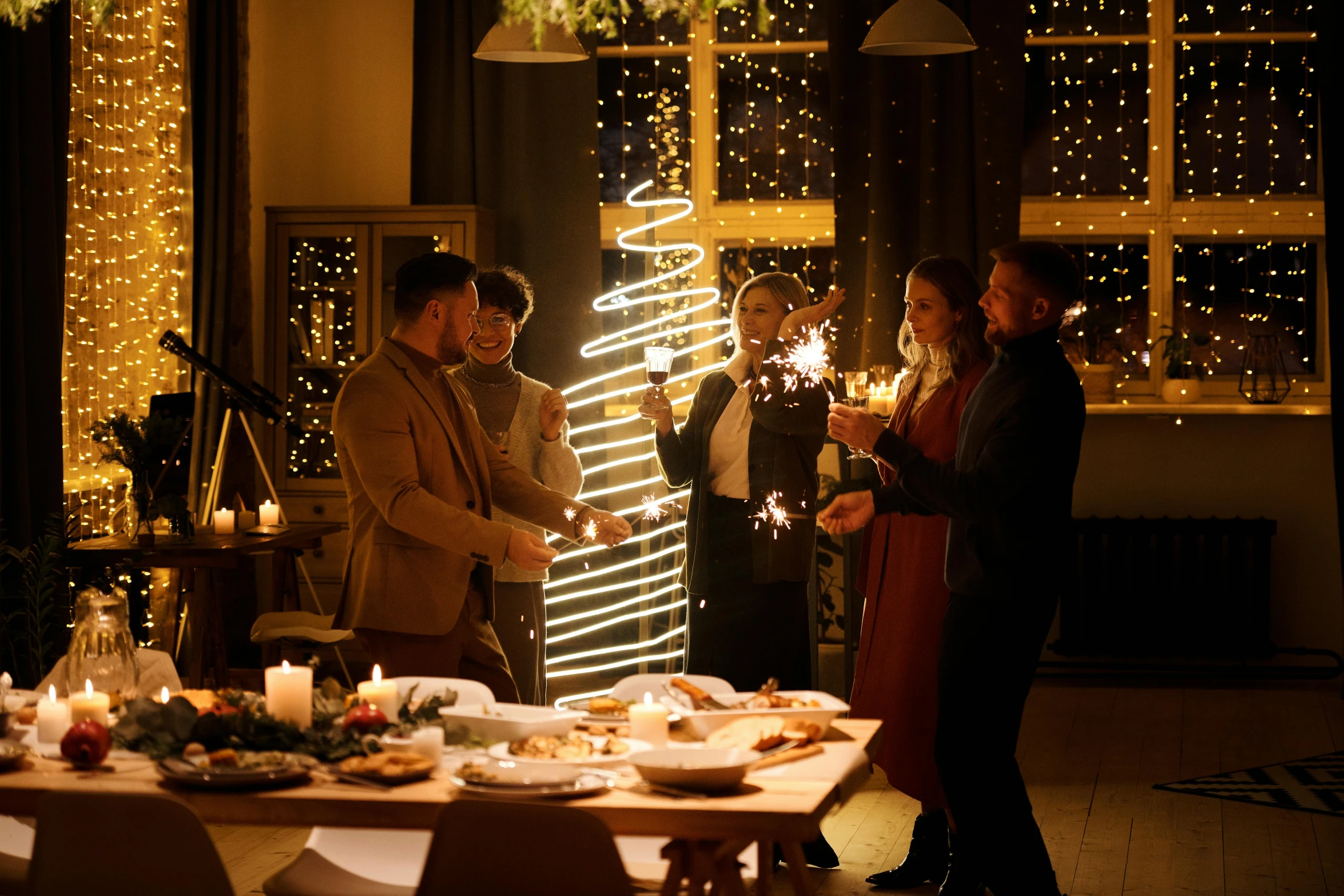 a group of people standing around a table holding sparklers, figuration libre, christmas, dinner is served, profile image, cyber copper spiral decorations