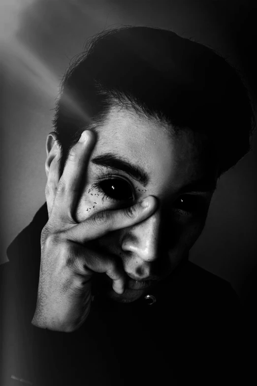 a black and white photo of a man holding his hands to his face, by Alexis Grimou, with haunted eyes and dark hair, ramil sunga, (high contrast), riyahd cassiem