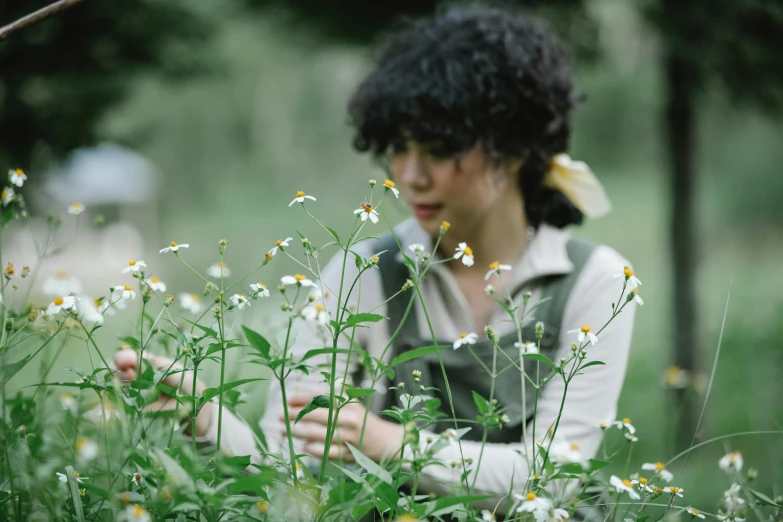 a woman standing in a field of flowers, by Yasushi Sugiyama, unsplash, process art, sitting in the garden, holding daisy, production still, amongst foliage