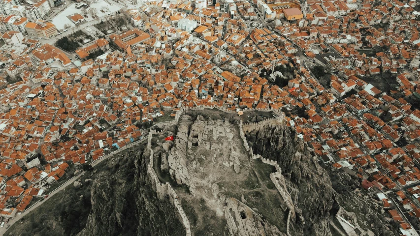 an aerial view of a city from a bird's eye view, pexels contest winner, byzantine ruins, “ aerial view of a mountain, can basdogan, 1990's photo