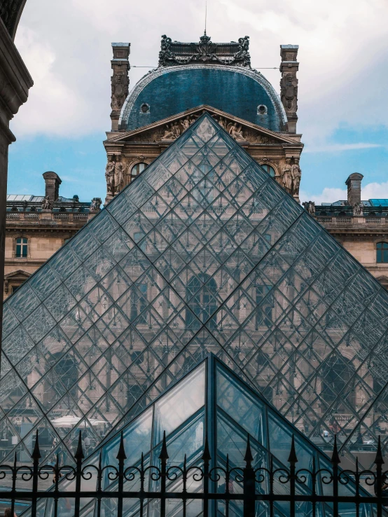 a large glass pyramid in front of a building, by Julia Pishtar, pexels contest winner, features between french, 🚿🗝📝