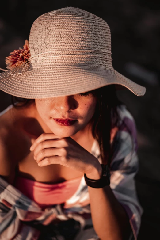 a close up of a person wearing a hat, at the sunset, 5 0 0 px models, hand on her chin, bali