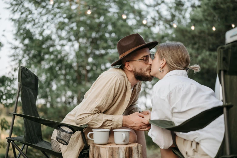 a man and a woman sitting next to each other, trending on pexels, peasant boy and girl first kiss, celebration of coffee products, cottage hippie naturalist, thumbnail