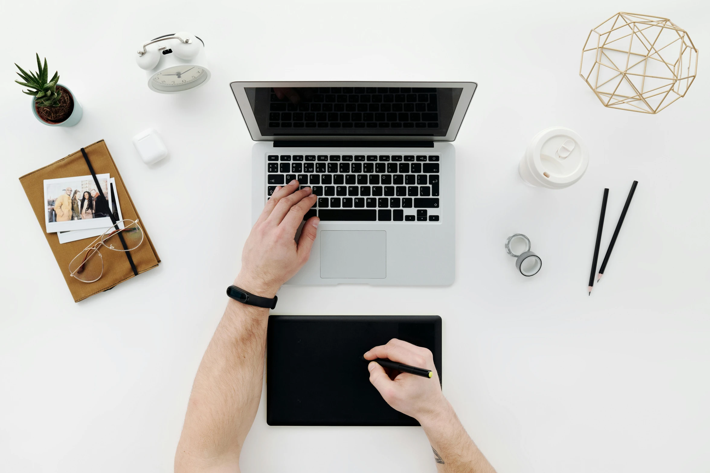 a person sitting at a desk working on a laptop, trending on pexels, arbeitsrat für kunst, white minimalistic background, background image, top - down photograph, 9 9 designs