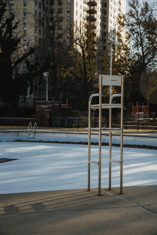 a man riding a skateboard up the side of a ramp, an album cover, by Sebastian Spreng, unsplash, conceptual art, pool tubes, berlin park, winter, stanchions