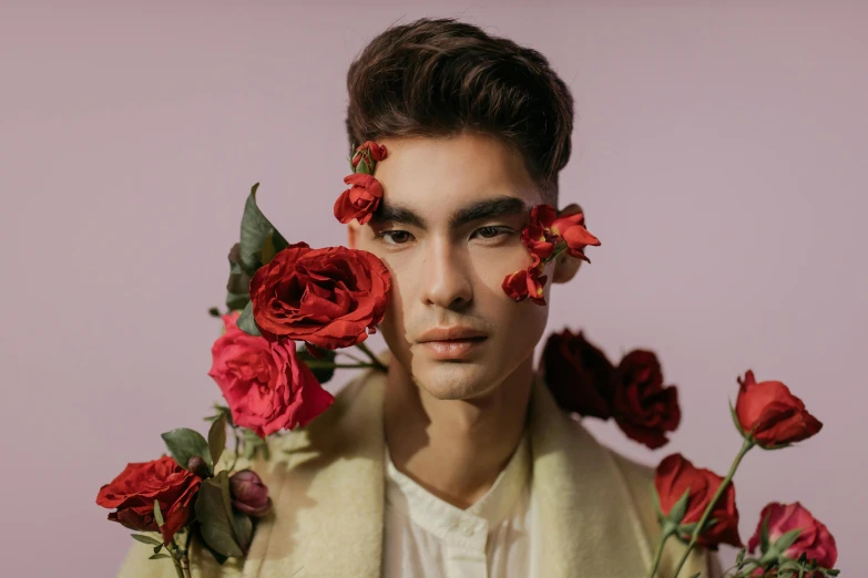 a man holding a bunch of red roses in front of his face, an album cover, inspired by John Luke, trending on pexels, beautiful androgynous prince, large eyebrows, asian human, pompadour