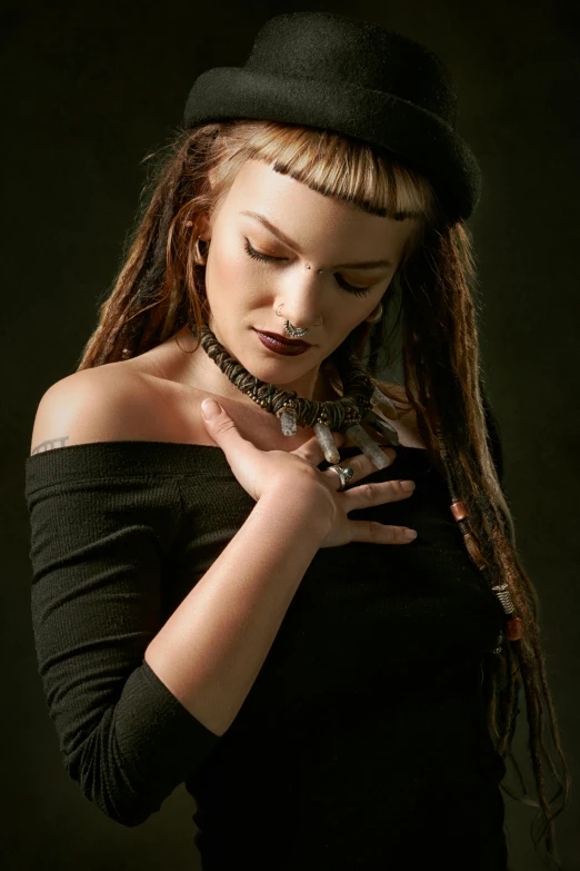 a woman with dreadlocks is posing for a picture, an album cover, trending on deviantart, antipodeans, photo of a hand jewellery model, seductive gaze, concert, 3 / 4 view portrait