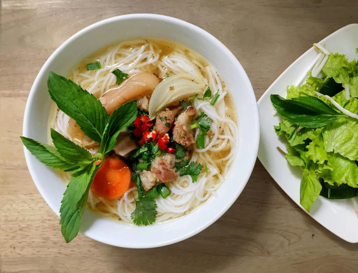 a couple of bowls of food on a table, inspired by Tan Ting-pho, pexels contest winner, dau-al-set, thumbnail, white, profile image, vietnam