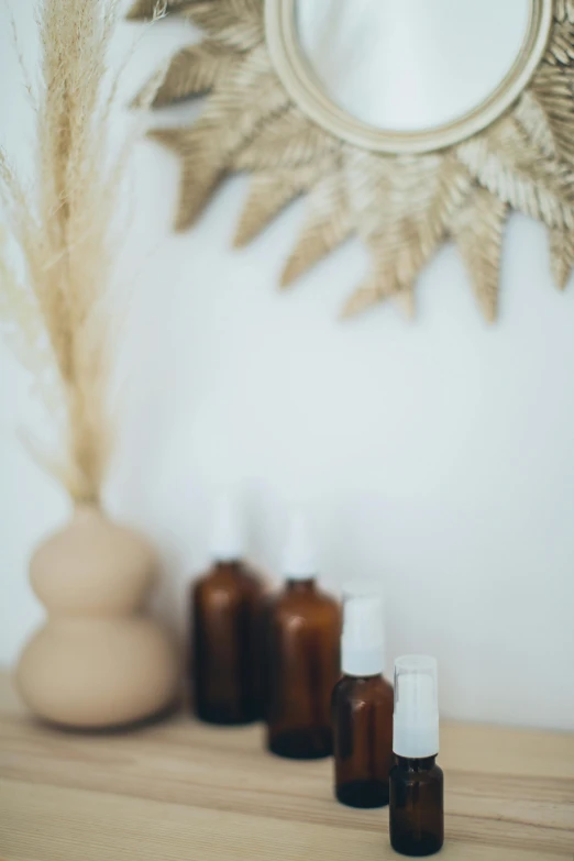 a group of bottles sitting on top of a wooden table, unsplash, in a white boho style studio, candy treatments, #oc, brown colours