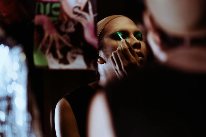 a man brushing his teeth in front of a mirror, inspired by Nan Goldin, trending on pexels, hyperrealism, dark green smokey eyeshadow, grace jones, intricate artwork. neon eyes, nvidia promotional image