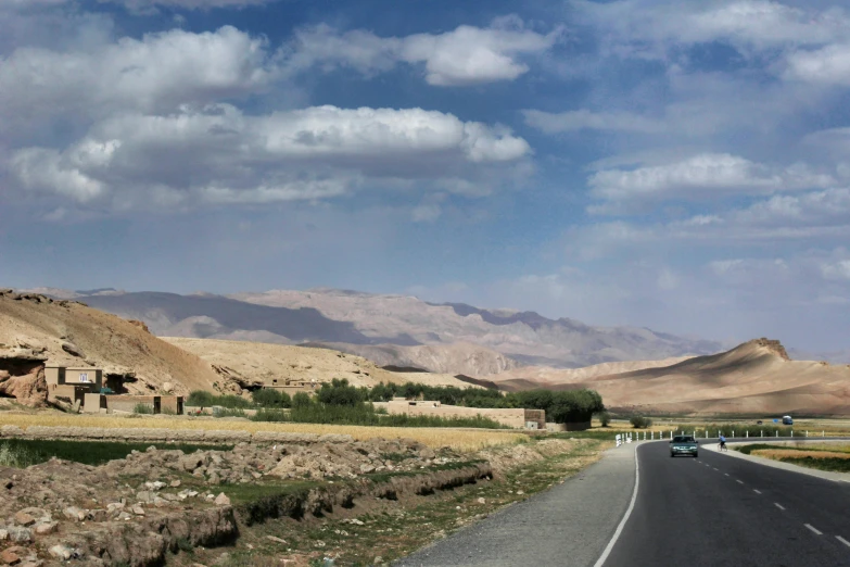 a car that is sitting on the side of a road, by Muggur, les nabis, panorama distant view, background image, adar darnov, schools