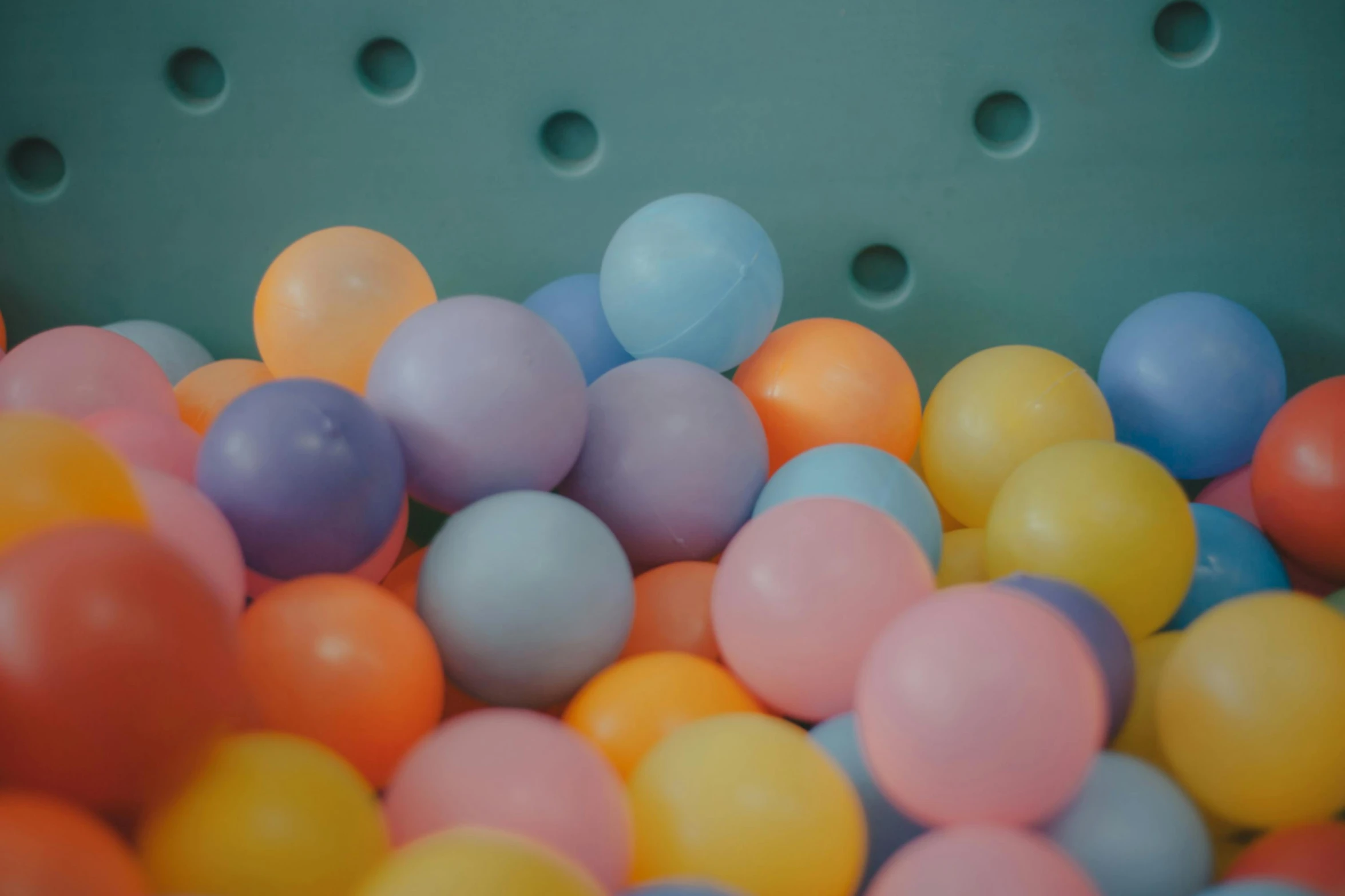 a bucket filled with lots of colorful balls, by Emma Andijewska, trending on unsplash, softplay, in pastel shades, inflatable, animation