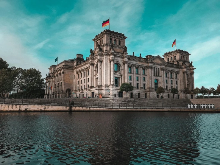 a large building next to a body of water, pexels contest winner, berlin secession, politics, thumbnail, 2045, historical