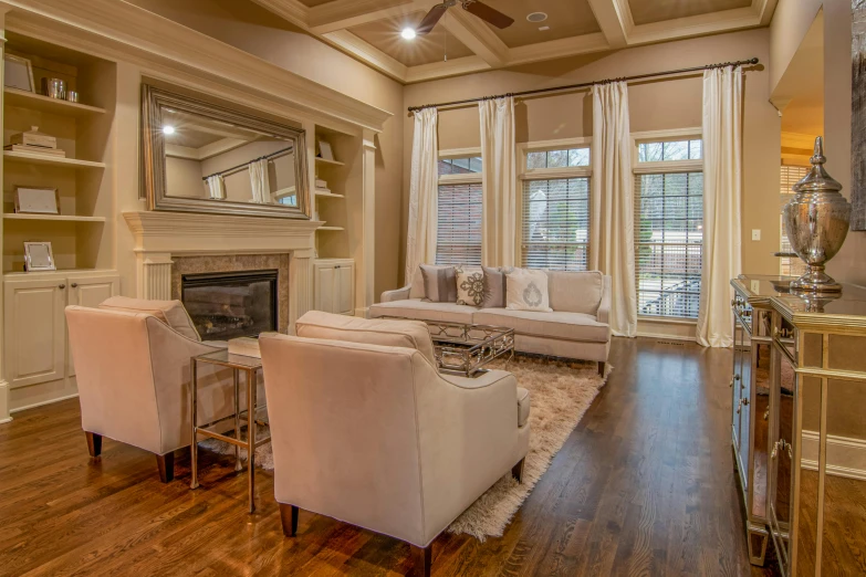 a living room filled with furniture and a fire place, a picture, full body image, hardwood floors, thumbnail, floor to ceiling window