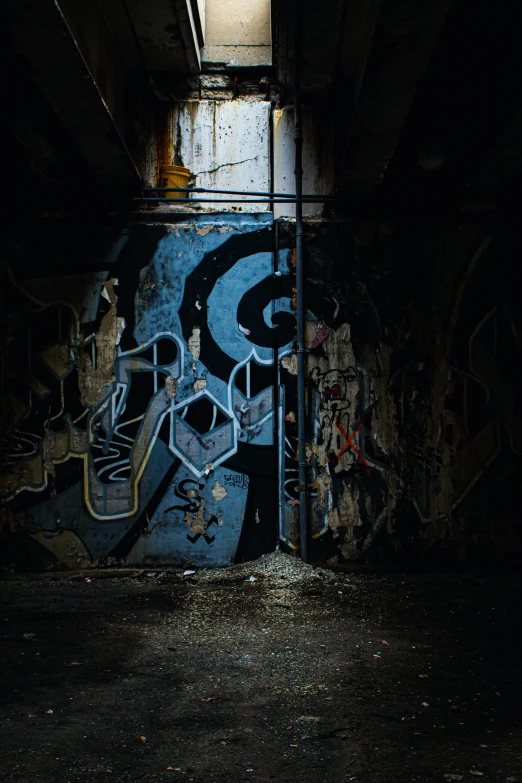 a dark room with graffiti on the walls, dark blues, grime, instagram post, exposed inner structure