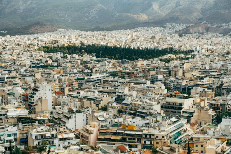 an aerial view of a city with mountains in the background, pexels contest winner, neoclassicism, greek, square, 2000s photo, brown