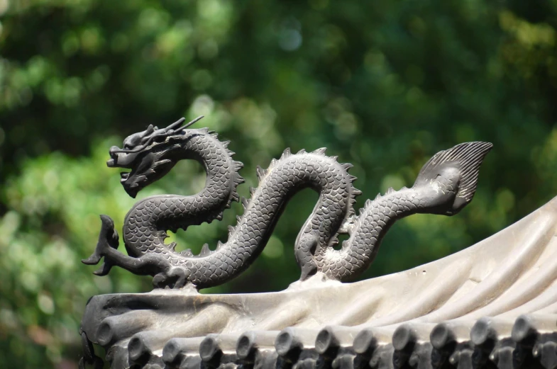 a statue of a dragon on top of a roof, inspired by Li Gonglin, pexels contest winner, shin hanga, grey, serpentine pose, avatar image, black