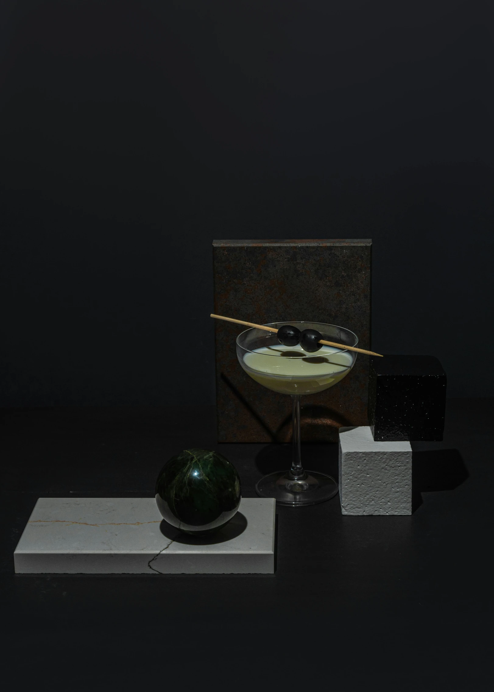 a glass filled with liquid sitting on top of a table, inspired by William Michael Harnett, suprematism, avacado dream, sangsoo jeong, detailed product image, moonlight grey