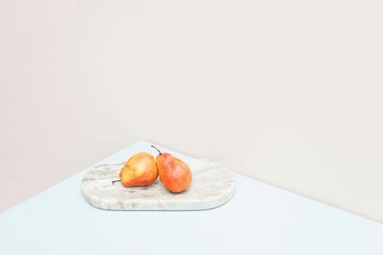 a couple of apples sitting on top of a cutting board, a still life, by Harvey Quaytman, unsplash, minimalism, made of marble, pale sky, pear, background image