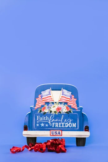 a blue truck with an american flag on it, an album cover, by Carey Morris, trending on unsplash, religious, parade floats, background image, colorful signs
