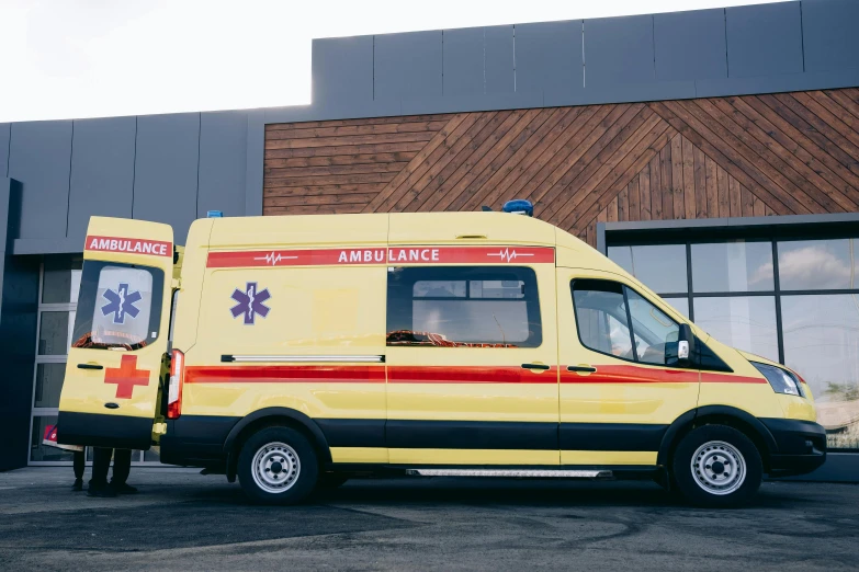 an ambulance parked in front of a building, pexels, hurufiyya, 9 9 designs, blank, worksafe. cinematic, wooden