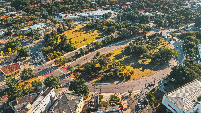 an aerial view of a city with lots of trees, by Lee Loughridge, unsplash, sydney park, empty streetscapes, panorama of crooked ancient city, 2 0 0 0's photo