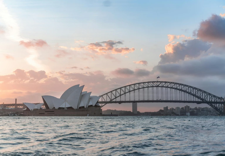 the sydney opera house and harbour bridge at sunset, pexels contest winner, fan favorite, pink arches, brown, dingy