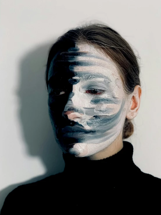 a woman with white paint on her face, inspired by Anna Füssli, dark visor covering top of face, dissociation, ignant, photo of a woman