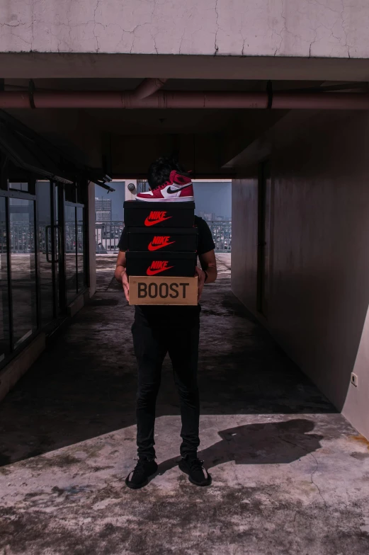 a man with a cardboard box on his back, pexels contest winner, graffiti, futuristic sneakers, booster flares, nike logo, promo image