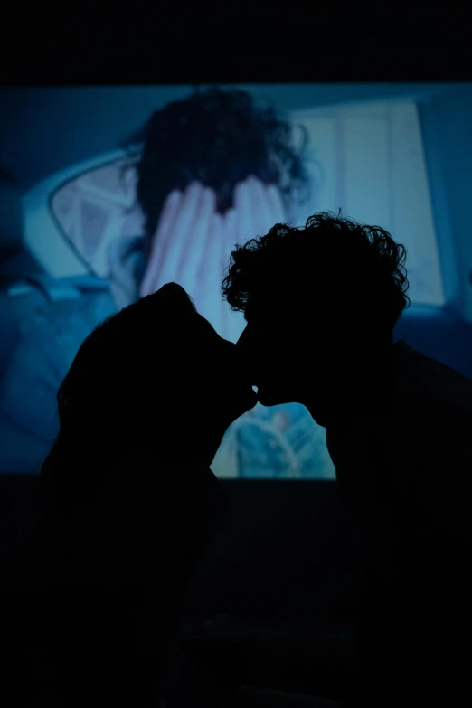 a person kissing a cat in the dark, inspired by Nan Goldin, video art, projection design installation, people's silhouettes close up, taken in the early 2020s, ( ( theatrical ) )