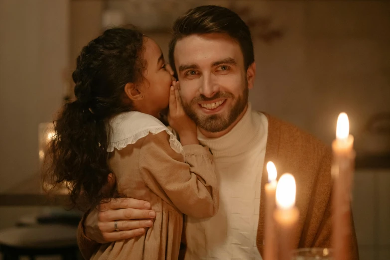 a man and a little girl sitting at a table with candles, pexels contest winner, symbolism, light stubble beard, hugs, 15081959 21121991 01012000 4k, brown