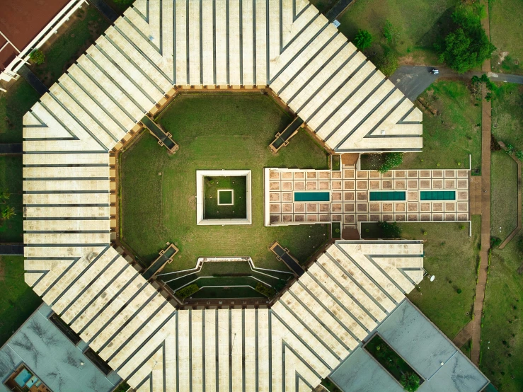 a bird's eye view of a tennis court, an album cover, by Bernardino Mei, pexels contest winner, islamic architecture, lawn, pentagon, shaved temple