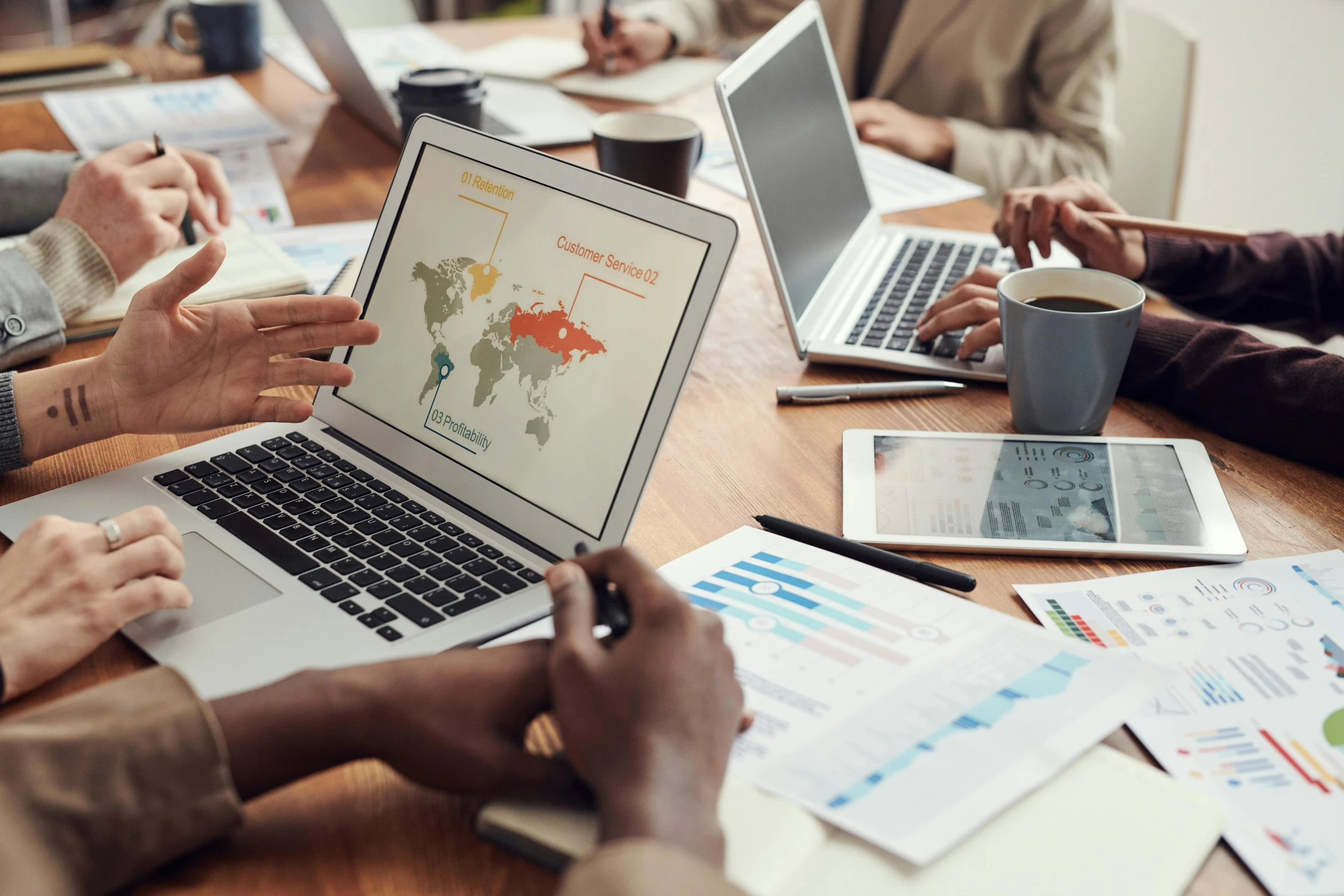 a group of people sitting around a table with laptops, analytical art, map, thumbnail, unblur, commercial