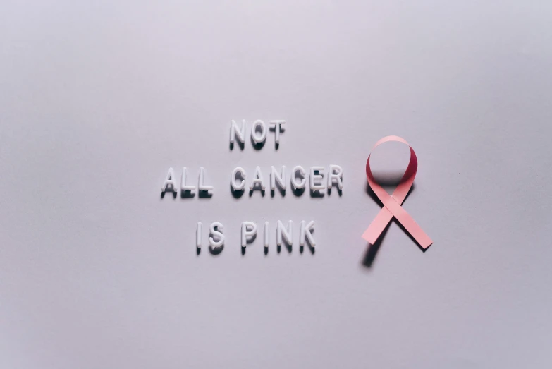 a pink ribbon with the words not all cancer is pink, a photo, by Emma Andijewska, pexels contest winner, renaissance, paper cut out, casual, 15081959 21121991 01012000 4k, surgery