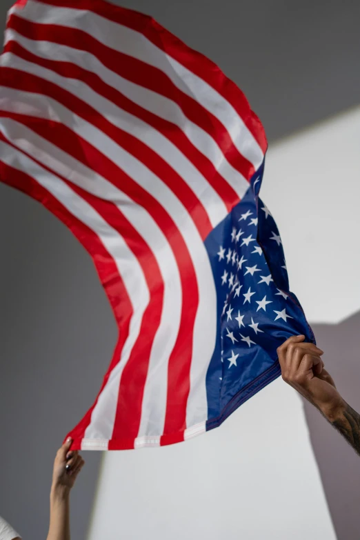 a person holding an american flag in the air, a tattoo, unsplash, slide show, state of the union, digital image, ap