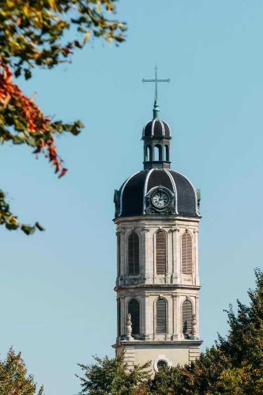 a tall tower with a clock on top of it, a picture, by Jan Tengnagel, trending on unsplash, paris school, holy cross, chesterfield, square, autumnal