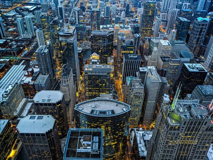 an aerial view of a city at night, by Dan Christensen, chicago skyline, concrete jungle, instagram photo, professionally designed