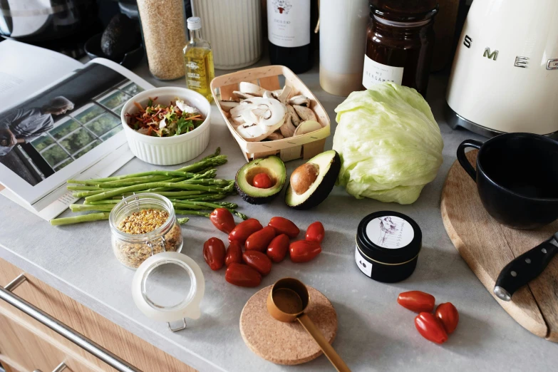 a counter topped with lots of different types of food, by Julia Pishtar, unsplash, clean face and body skin, on kitchen table, goop, sustainable materials