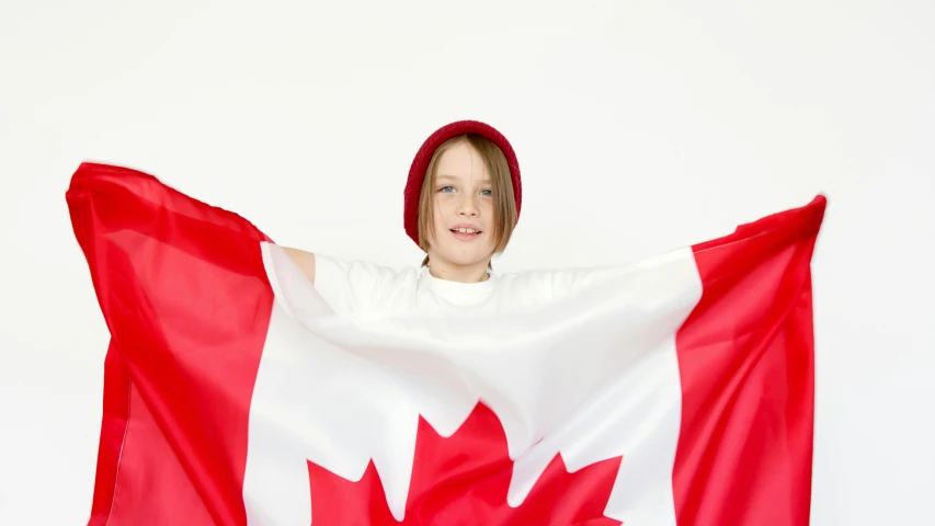 a person holding a canadian flag in front of a white background, vancouver school, avatar image, sophia lillis, promo image, small