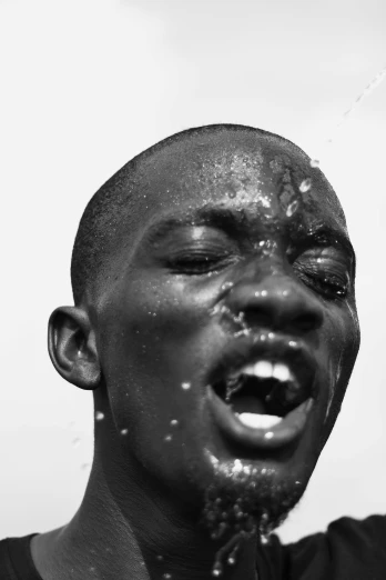 a black and white photo of a man brushing his teeth, an album cover, inspired by David Bailly, big drops of sweat, adut akech, anato finnstark. perfect faces, there is water splash