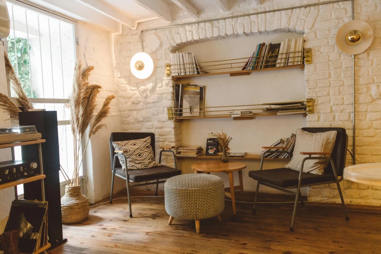 a living room filled with furniture next to a window, pexels contest winner, light and space, books cave, cafe interior, cozy arm chairs, thumbnail