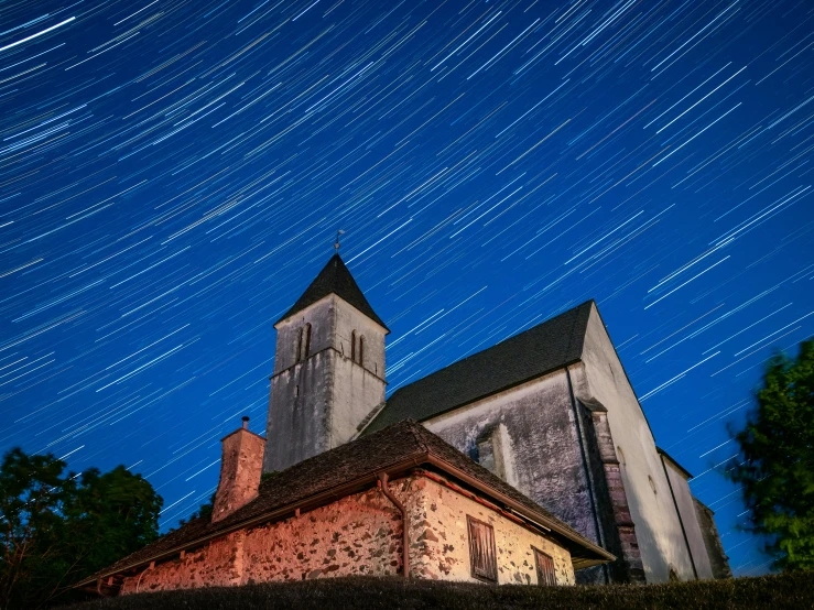 a church with a star trail in the sky, unsplash contest winner, renaissance, st cirq lapopie, late summer evening, star charts, in dunwall