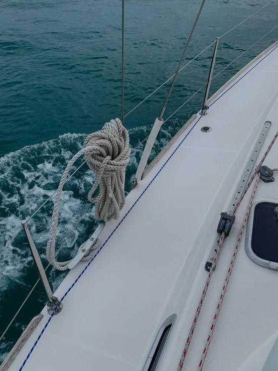 a view of the ocean from the bow of a sailboat, a picture, pexels contest winner, happening, spiralling, high angle close up shot, trying to escape, hyperdetailed!