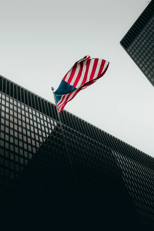 an american flag flying in front of a tall building, pexels contest winner, modernism, puerto rico, alessio albi, pittsburgh, office building