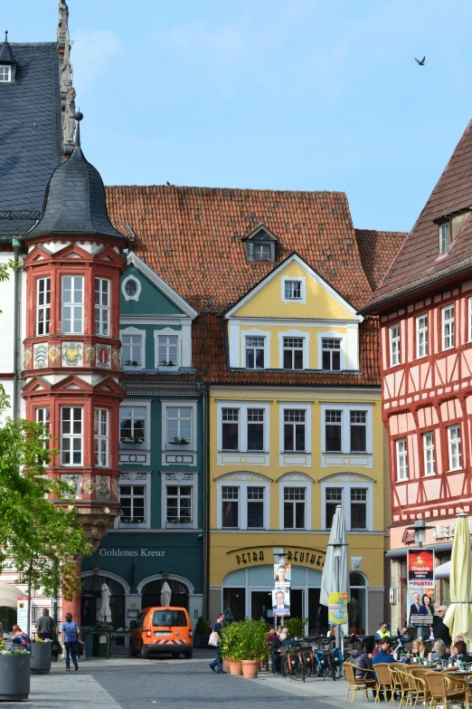 a group of buildings that are next to each other, inspired by Georg Friedrich Schmidt, renaissance, market square, colorful”, germany, coastal