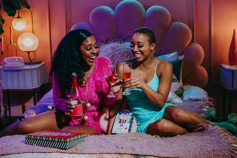 a couple of women sitting on top of a bed, pexels, happening, doja cat, with a drink, 🎀 🧟 🍓 🧚, netflix