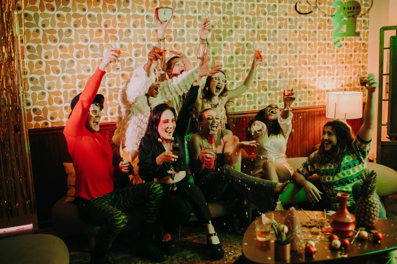 a group of people sitting on top of a couch, by Julia Pishtar, pexels, severus snape dance in a bar, fancy dress, 1 9 7 0 s photo, battle toast