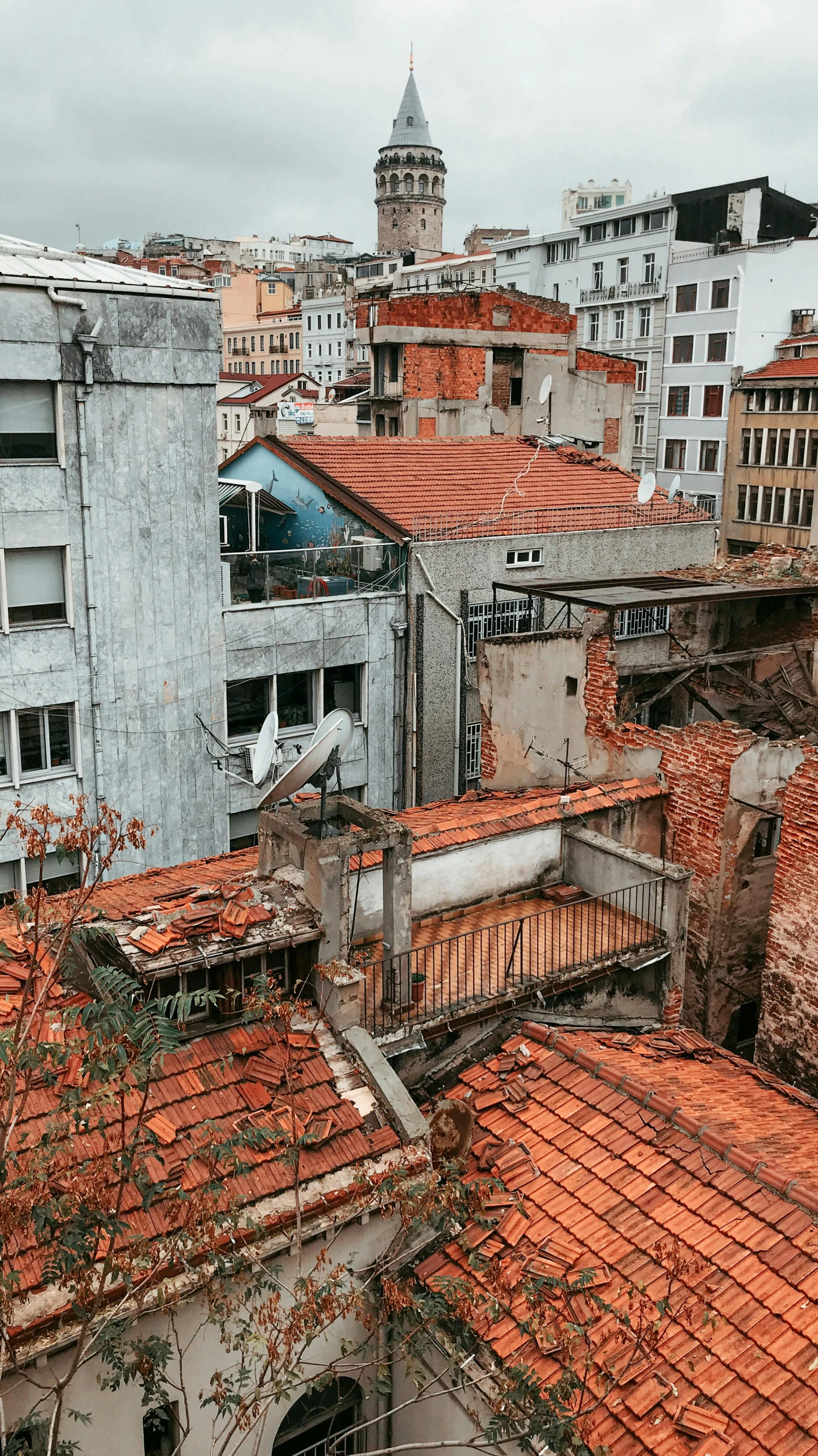 a group of buildings with a clock tower in the background, inspired by Thomas Struth, pexels contest winner, remodernism, brick debris, fallout style istanbul, a high angle shot, são paulo