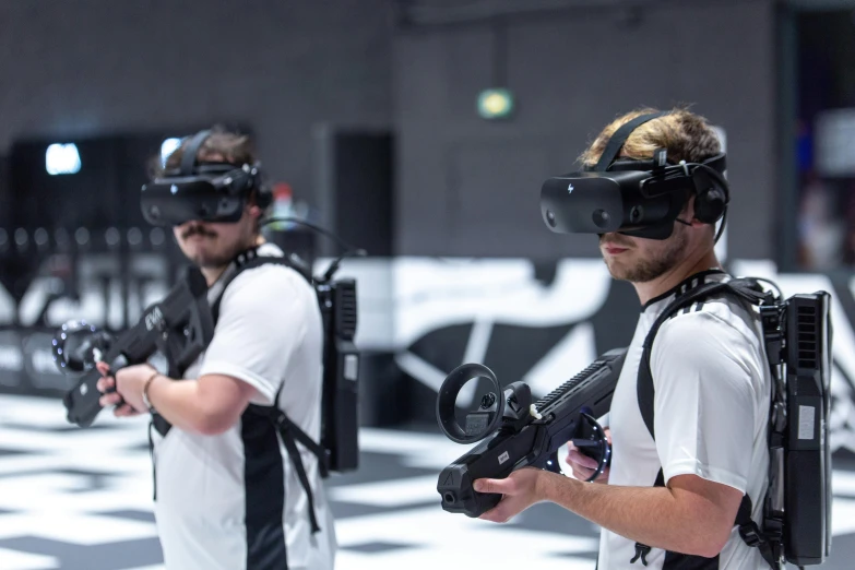 a couple of men standing next to each other wearing virtual glasses, softair arena landscape, press shot, ninjas, afp