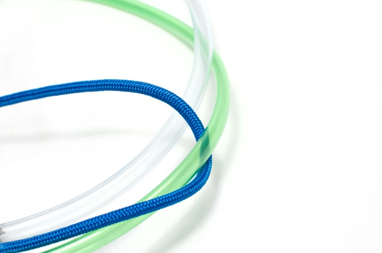 a couple of wires that are connected to each other, by Nina Hamnett, plasticien, gradient white blue green, close-up product photo, circlet, nylon